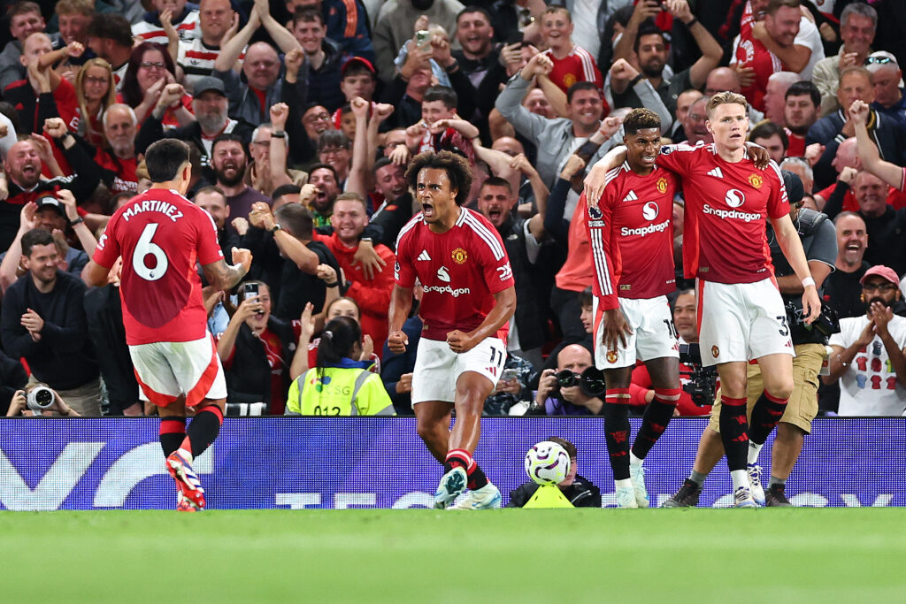 Joshua Zirkzee celebrates scoring the winning goal during Manchester United's opening day match against Fulham at Old Trafford.