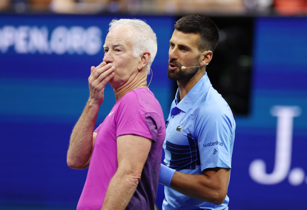 Novak Djokovic and John McEnroe playing an exhibition at the 2024 US Open