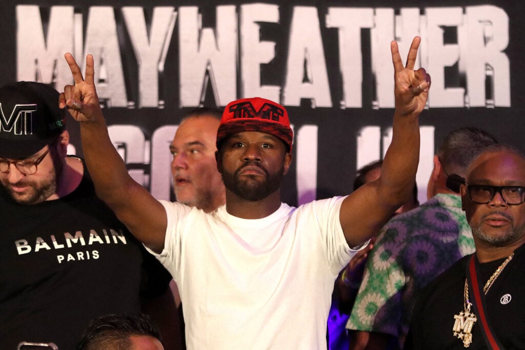 Floyd Mayweather Jr does the peace and love sign during the Weigh-Ins ahead of his exhibition fight with John Gotti III