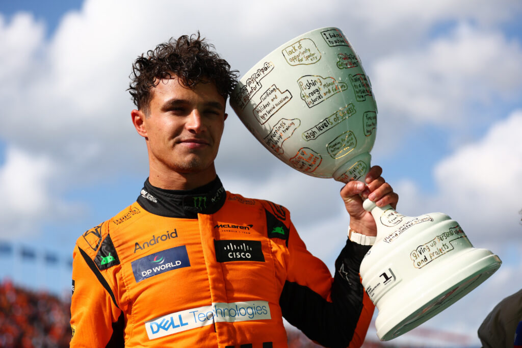 Lando Norris poses with the race-winner's trophy after the 2024 Dutch Grand Prix