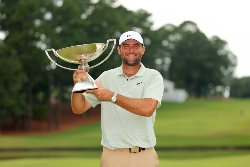 Scottie Scheffler of the United States celebrates with the FedExCup Trophy