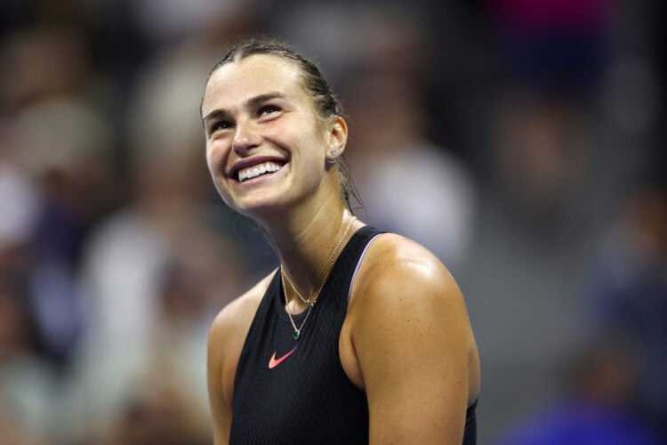 Aryna Sabalenka smiling during her match with Emma Navarro at the 2024 US Open