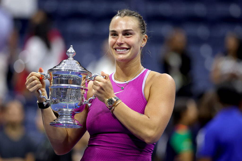 Aryna Sabalenka holding the 2024 US Open trophy