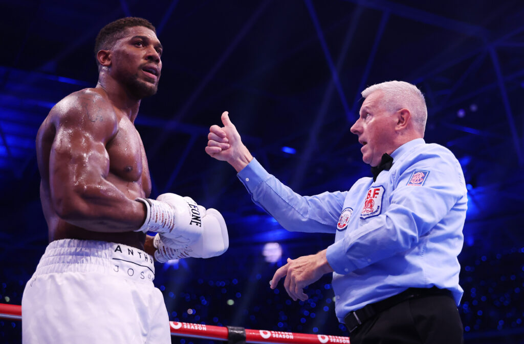 Anthony Joshua reacts as he is counted down by referee Marcus McDonnell