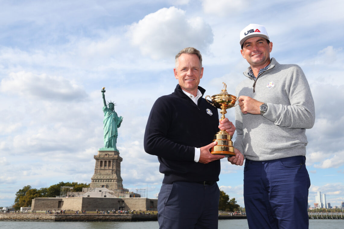 Team Captains Luke Donald of England and Keegan Bradley of The United States pose for a photograph with the Ryder Cup Trophy in front of the Statue...
