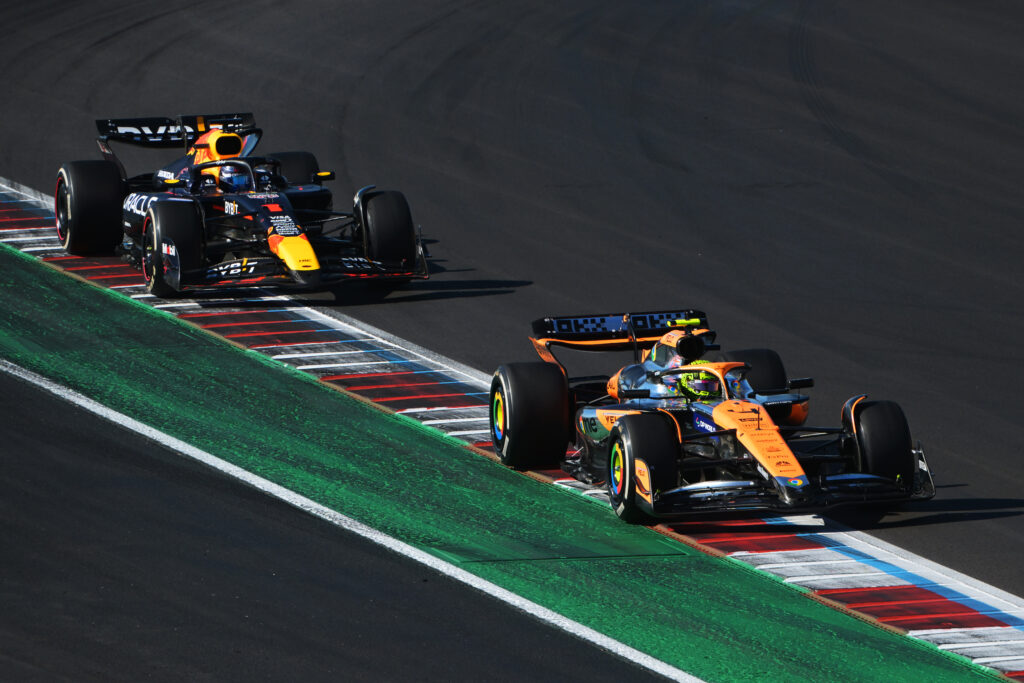 Max Verstappen of Red Bull on track with Lando Norris of McLaren