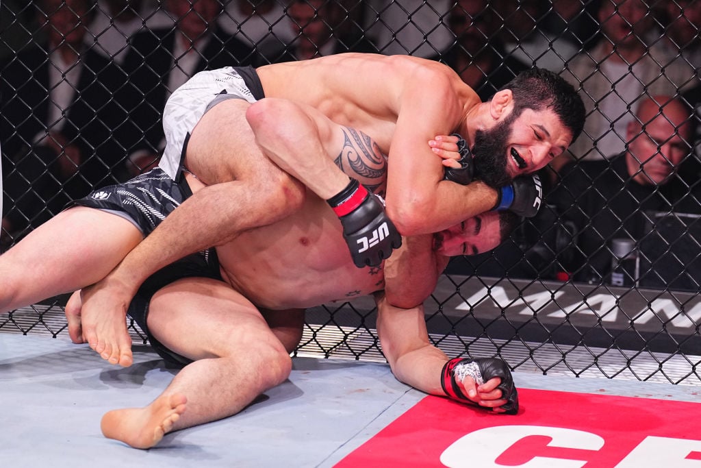 Khamzat Chimaev of Russia secures a submission against Robert Whittaker