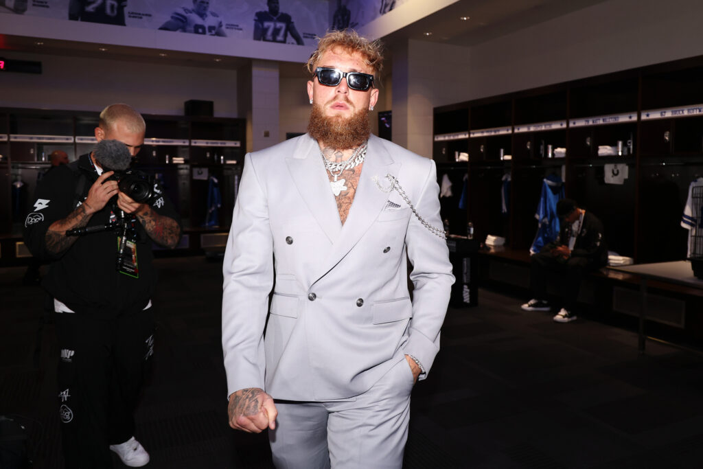 Jake Paul poses in a suit ahead of Mike Tyson fight