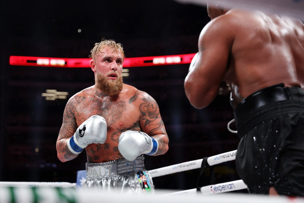 Jake Paul looks at Mike Tyson during fight