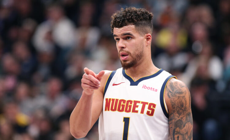 Michael Porter Jr., #1 of the Denver Nuggets gestures to a teammate