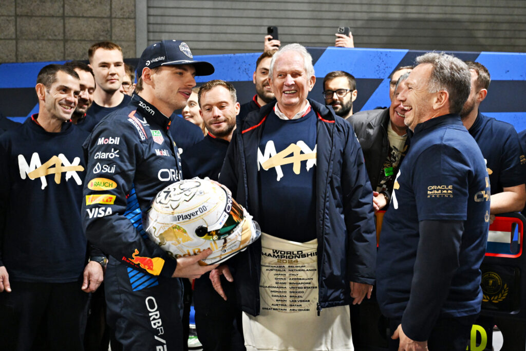 Max Verstappen celebrates winning his fourth F1 drivers' title for Red Bull with Helmut Marko and Christian Horner after the 2024 Las Vegas Grand Prix