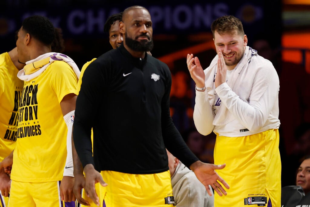 LeBron James #23 and Luka Doncic #77 of the Los Angeles Lakers react