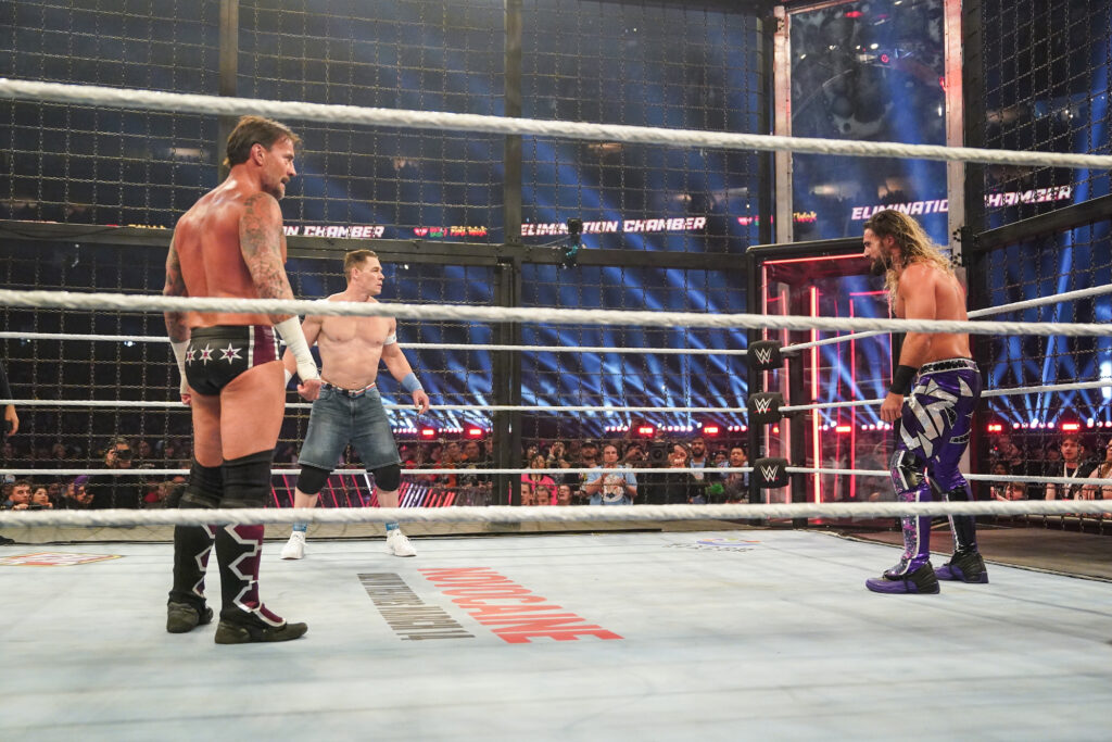 CM Punk, John Cena, and Seth Rollins at the WWE Elimination Chamber in 2025