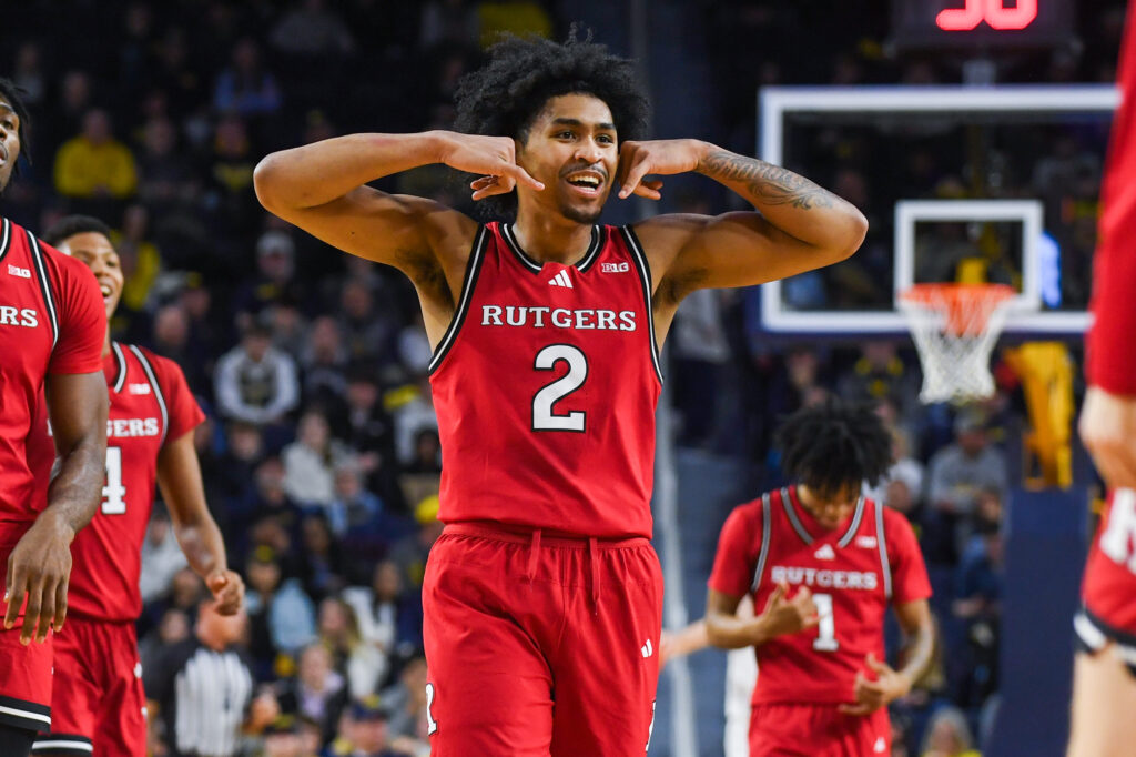 Dylan Harper #2 of the Rutgers Scarlett Knights celebrates during the first half of a college basketball game against the Michigan Wolverines.