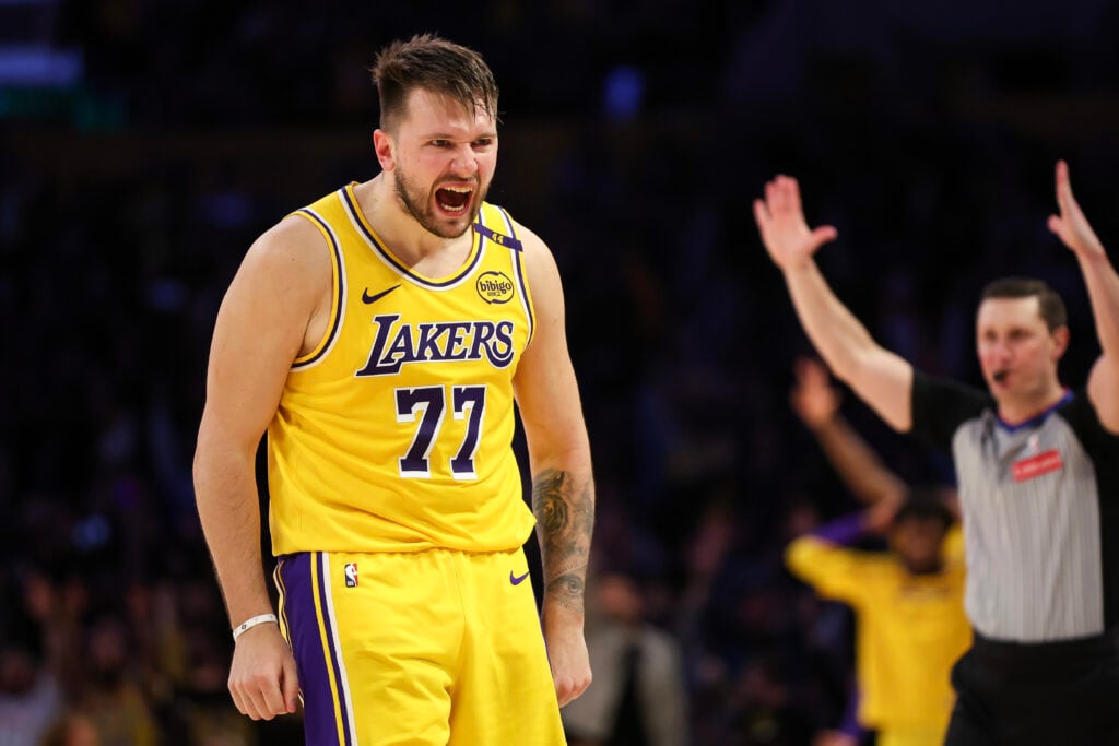 Luka Doncic #77 of the Los Angeles Lakers reacts after making a three-point basket