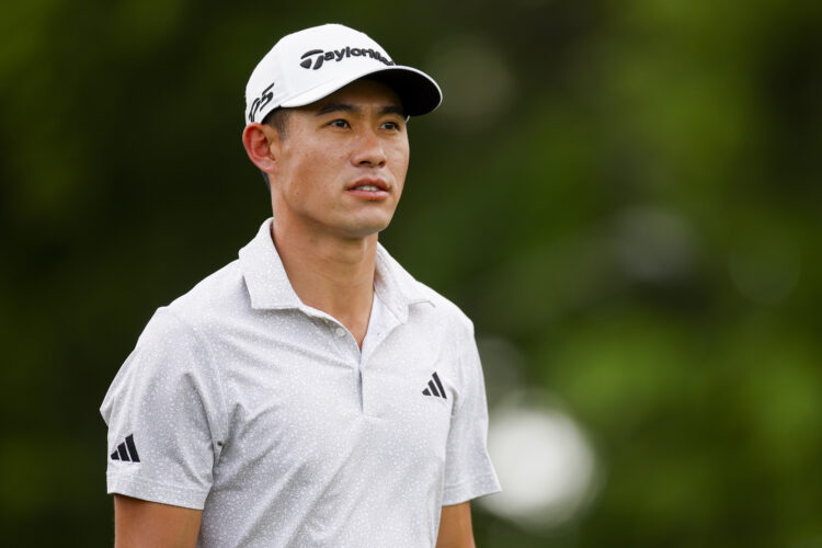 Collin Morikawa looks on while playing