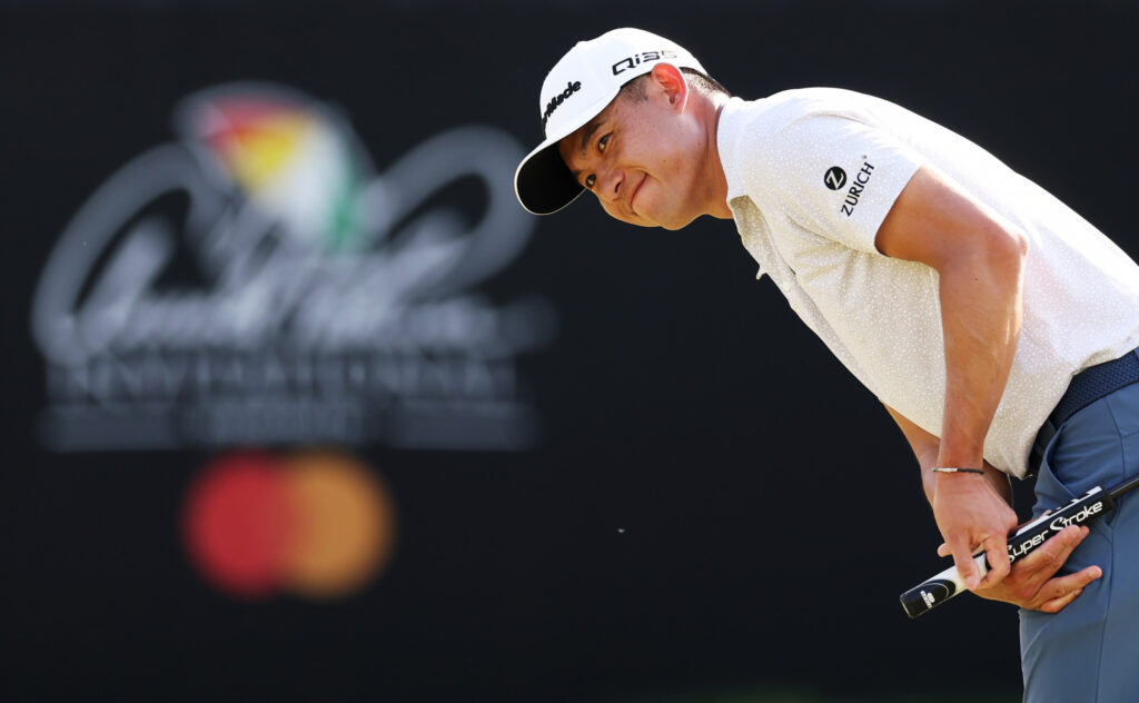Collin Morikawa grimaces after a putt