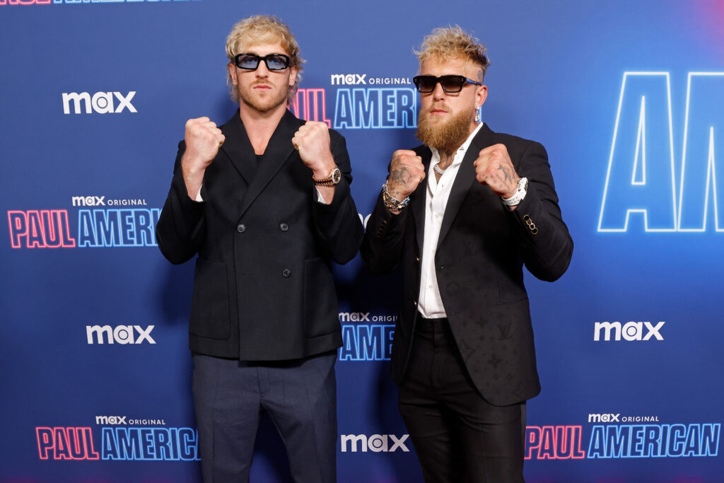 Jake and Logan Paul pose at a premiere of their TV show