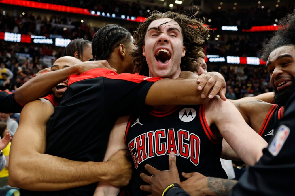 Josh Giddey #3 of the Chicago Bulls celebrates with teammates after hitting a game-winning three pointer