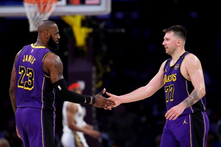 LeBron James #23 and Luka Doncic #77 of the Los Angeles Lakers shake hands