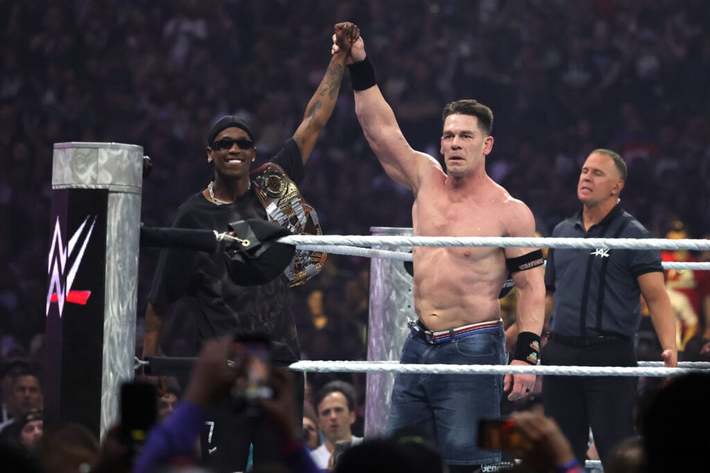 John Cena having his hand raised by Travis Scott after beating Cody Rhodes at WrestleMania 41