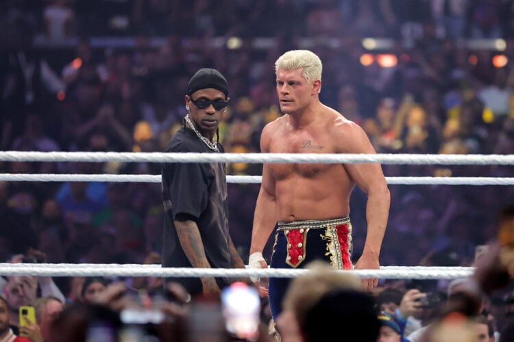 Travis Scott faces off against Cody Rhodes during the WWE Championship match