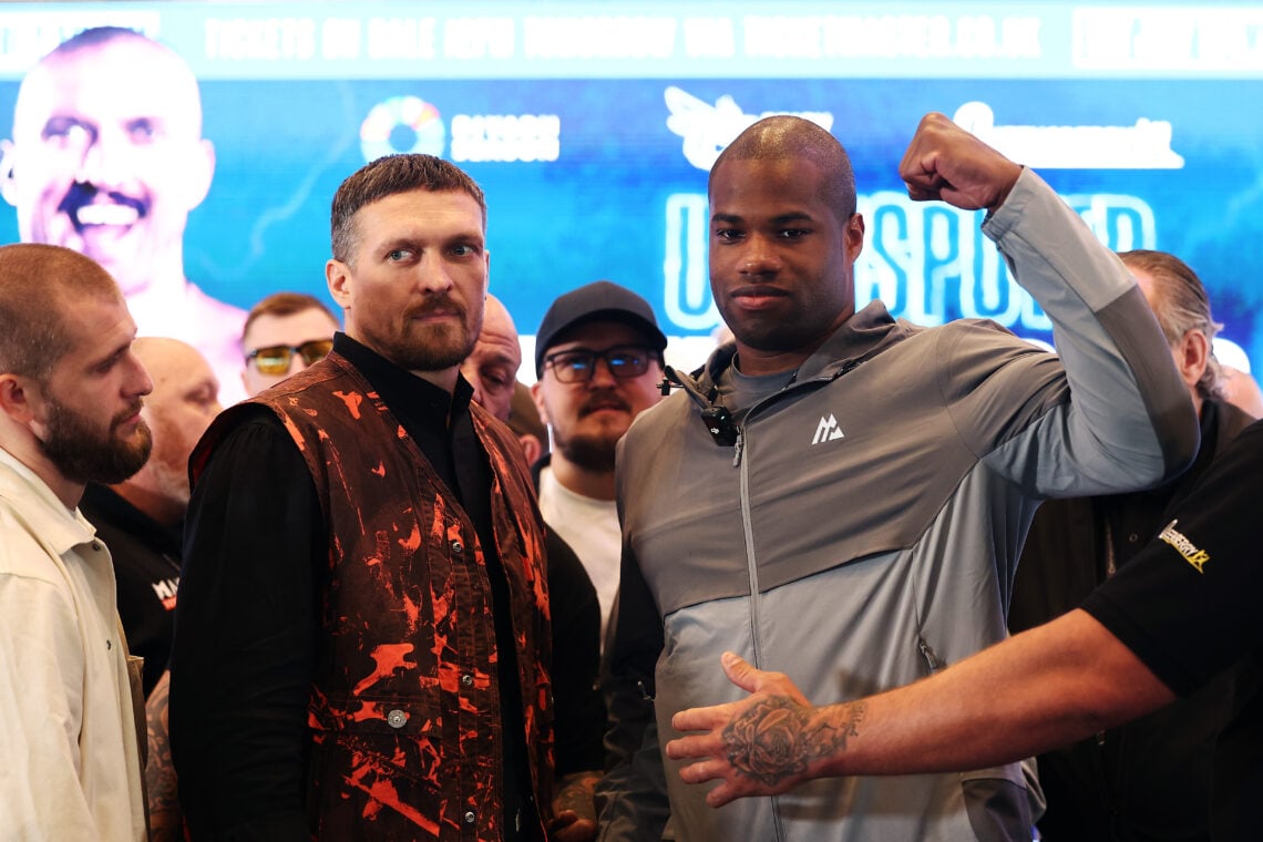 Oleksandr Usyk and Daniel Dubois pose together after facing off during their press conference to promote their rematch