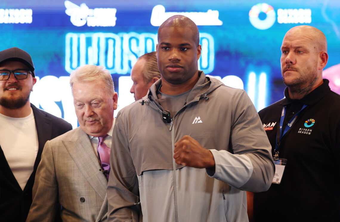 Daniel Dubois poses for a photo after facing off against Oleksandr Usyk during their press conference