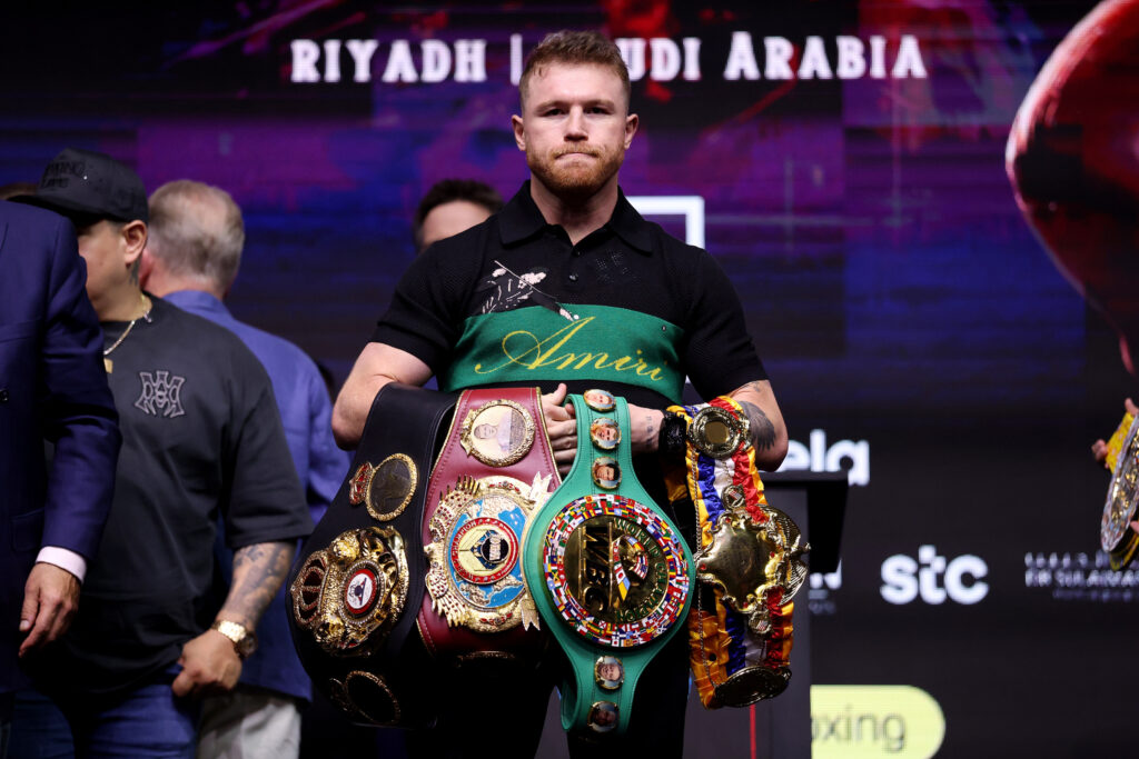 Canelo Alvarez poses with titles ahead of William Scull fight