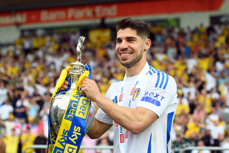 Manor Solomon celebrates with the Championship title after Plymouth Argyle FC v Leeds United FC