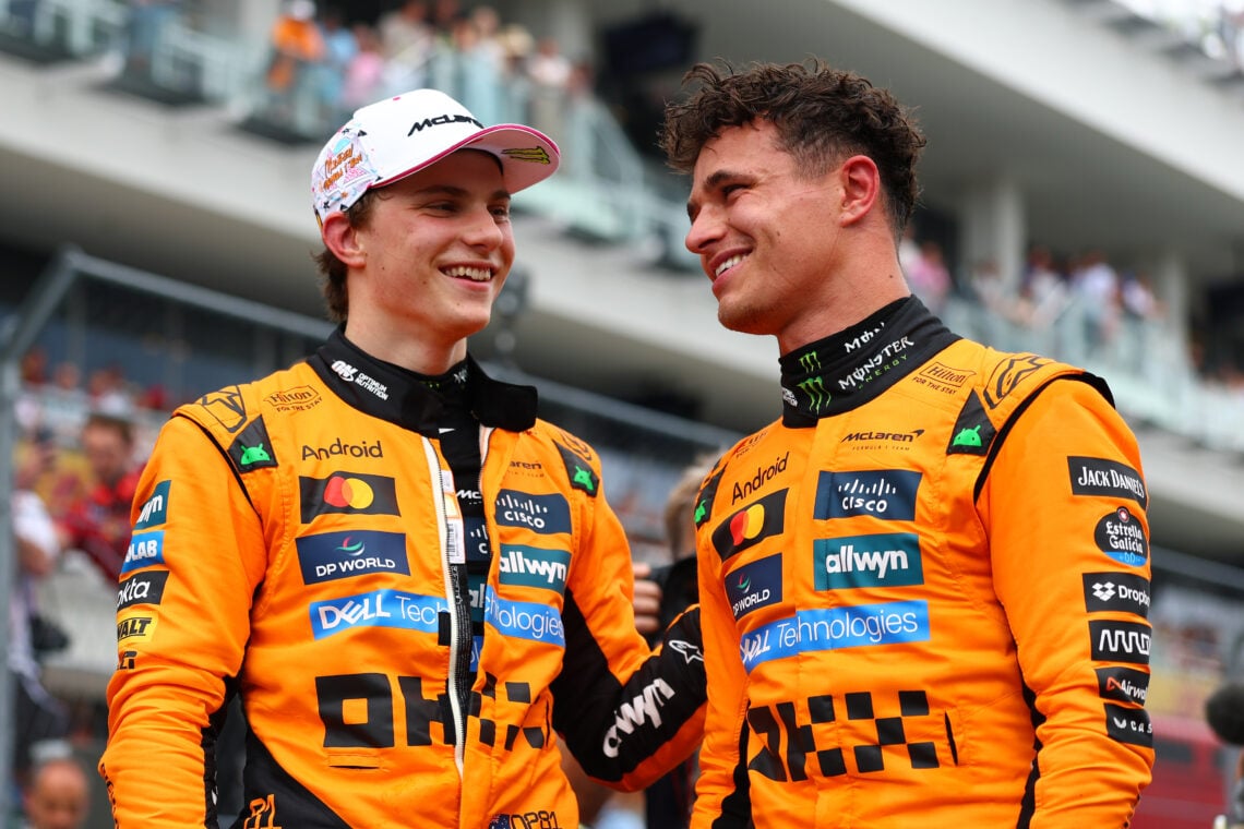 Lando Norris of and Oscar Piastri of McLaren talk in parc ferme