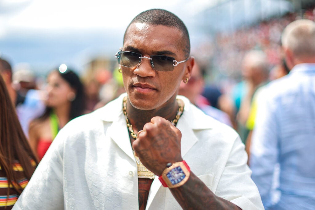 Conor Benn, a boxer and paddock guest, walks on track during the grid walk