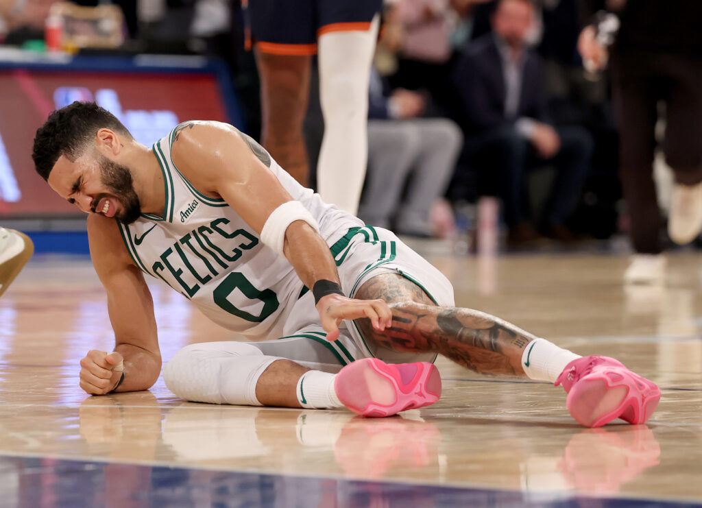 Jayson Tatum #0 of the Boston Celtics lays on the ground after being injured against the New York Knicks