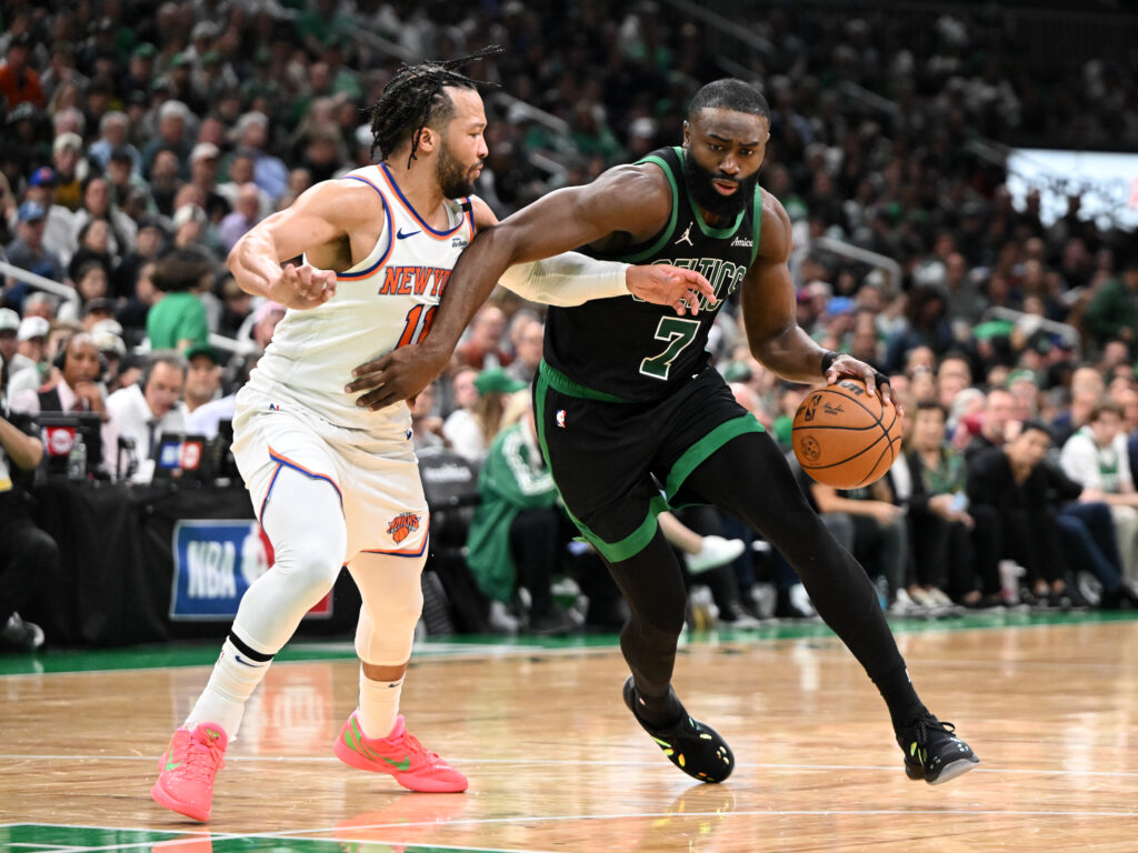 Jaylen Brown of the Boston Celtics drives to the basket against Jalen Brunson of the New York Knicks