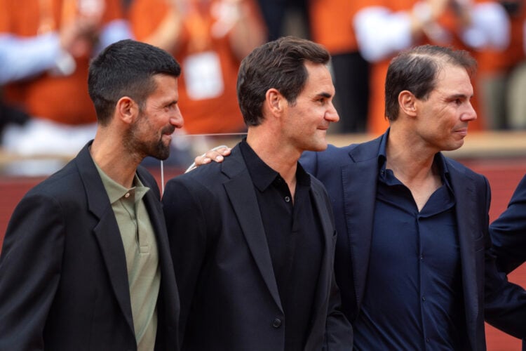 Rafael Nadal of Spain with Roger Federer, and Novak Djokovic during his presentation ceremony paying tribute to his career