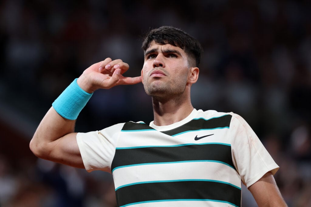 Carlos Alcaraz listening to the crowd reaction at the 2025 Roland Garros