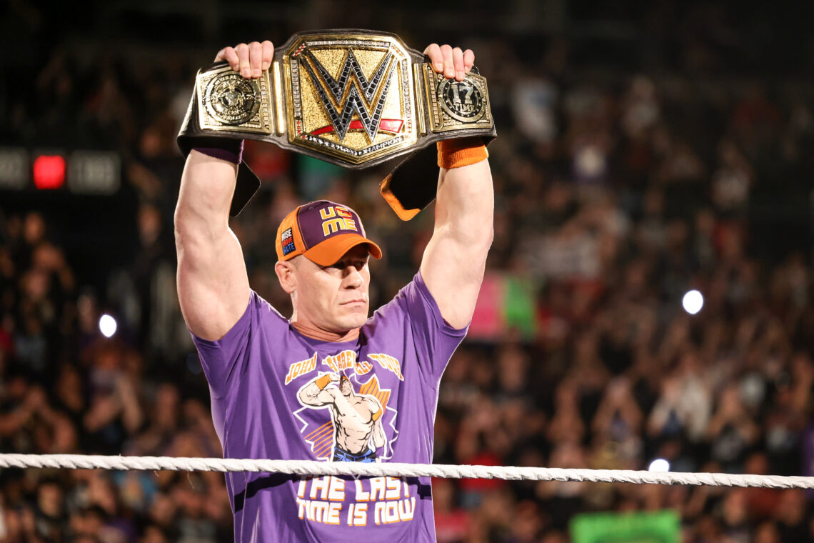 John Cena holding the WWE Championship aloft on WWE Monday Night RAW
