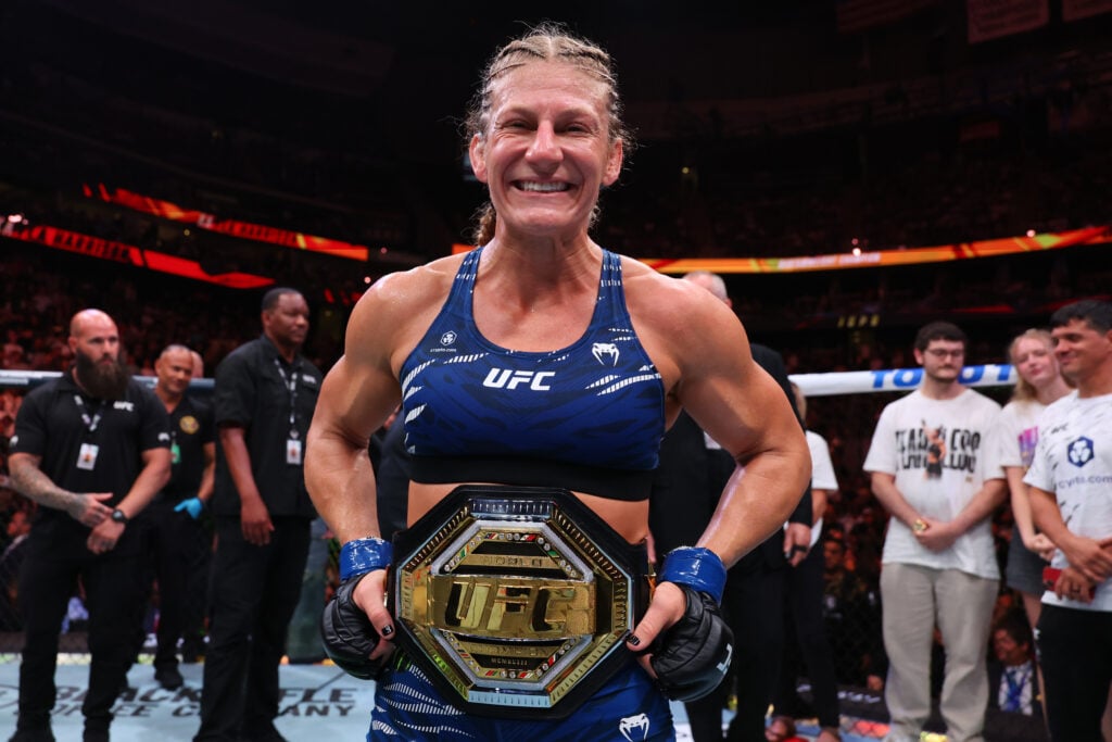 Kayla Harrison celebrates after defeating Julianna Pena