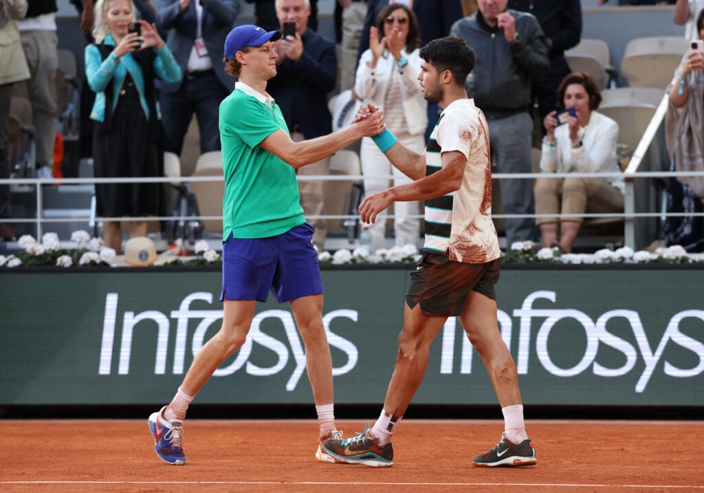 Carlos Alcaraz and Jannik Sinner shaking hands in the Roland Garros 2025 final