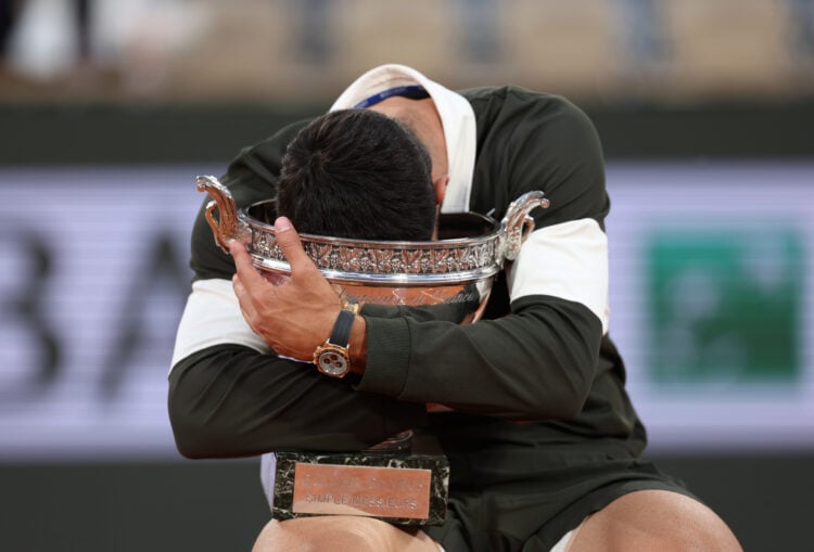Carlos Alcaraz of Spain holds the Coupe des Mousquetaires