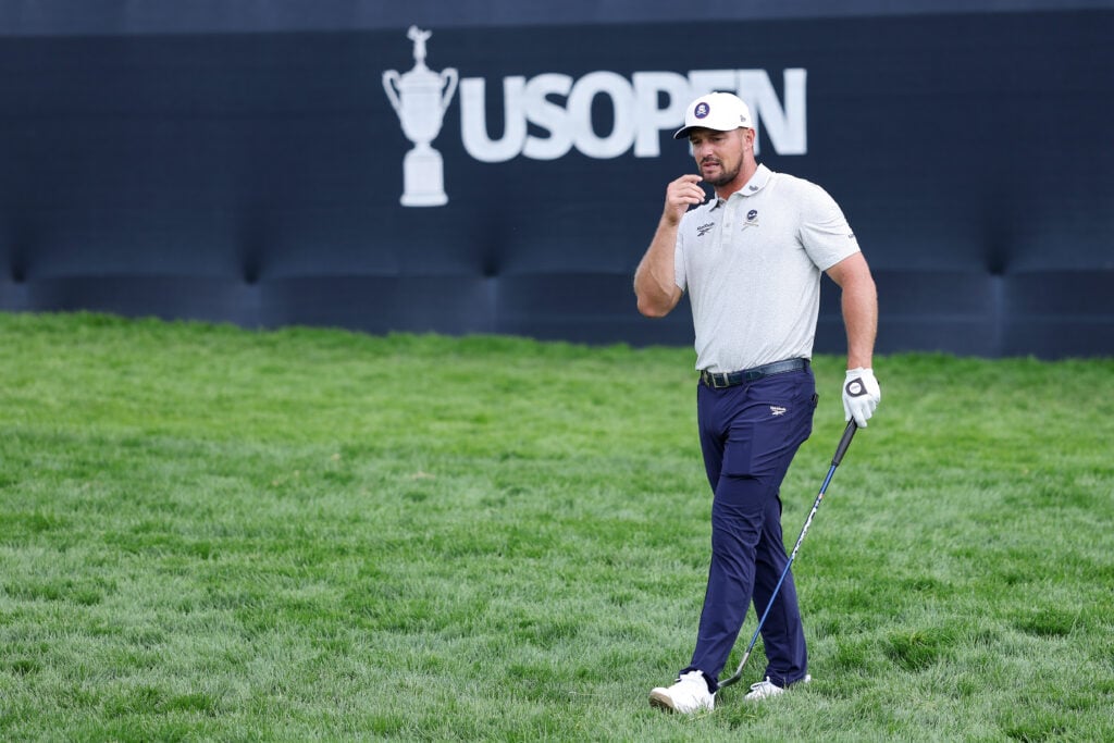 Bryson DeChambeau reacts on the 18th green during a practice round prior to the 125th U.S. OPEN at Oakmont Country Club