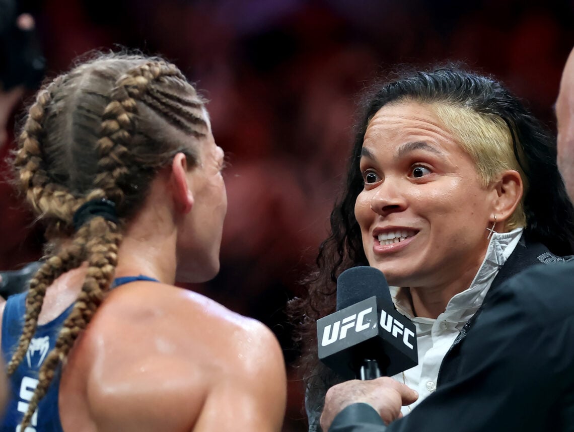 Kayla Harrison reacts with Amanda Nunes after winning the the bantamweight title