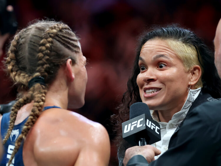 Kayla Harrison reacts with Amanda Nunes after winning the the bantamweight title