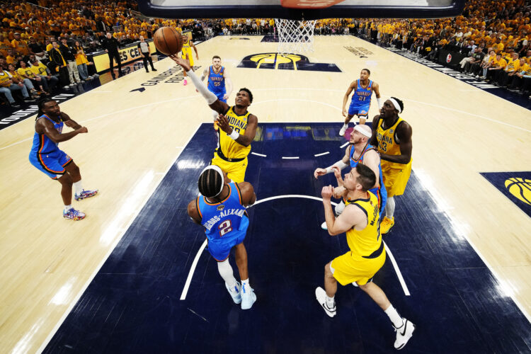 Bennedict Mathurin of the Indiana Pacers shoots the ball over Shai Gilgeous-Alexander of the Oklahoma City Thunder during the NBA Finals