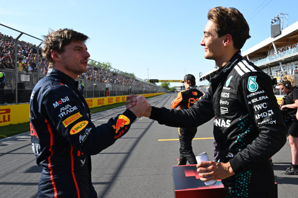George Russell shakes hands with Max Verstappen