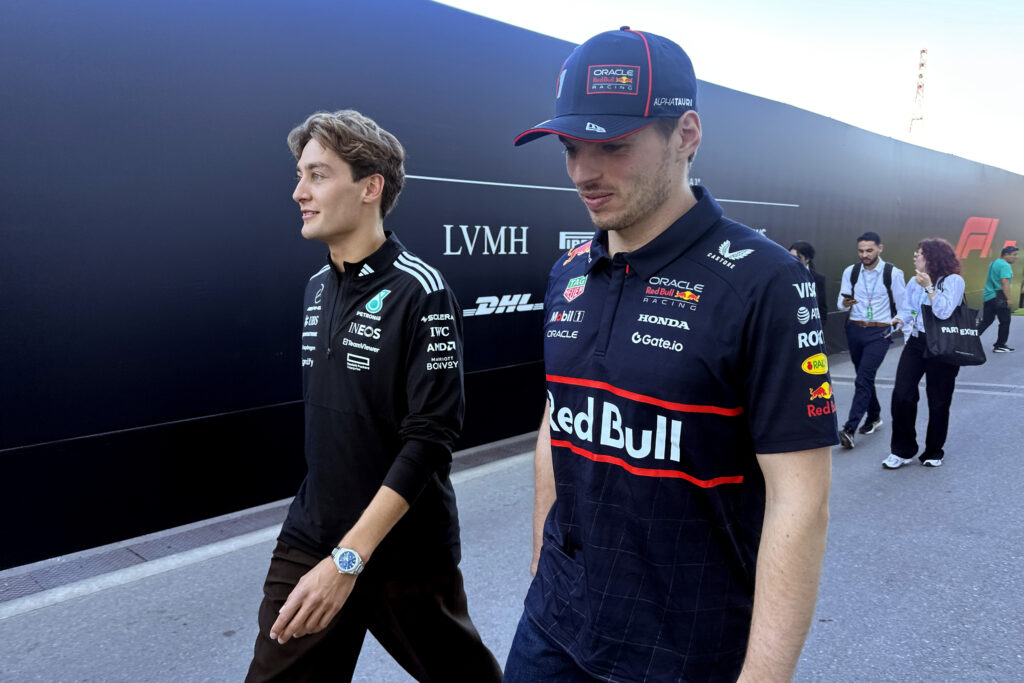 George Russell Mercedes and Max Verstappen of Red Bull Racing walk