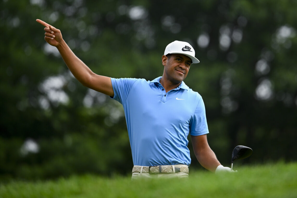 Tony Finau of The United States points right after his tee shot