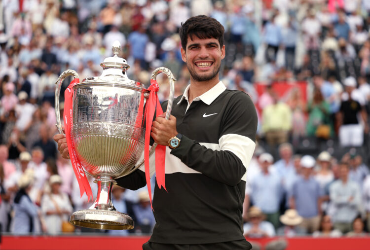 Carlos Alcaraz poses with the trophy after winning the 2025 HSBC Championship at Queen's Club.