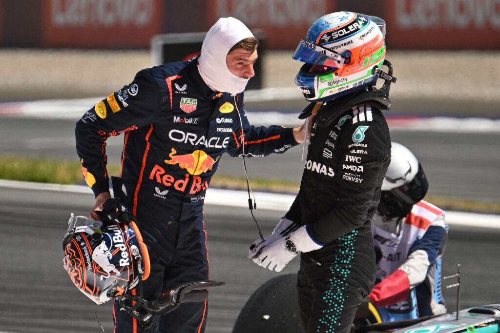 Red Bull driver Max Verstappen and Mercedes' driver Kimi Antonelli speak after their cars crashed during the Formula One Austrian Grand Prix