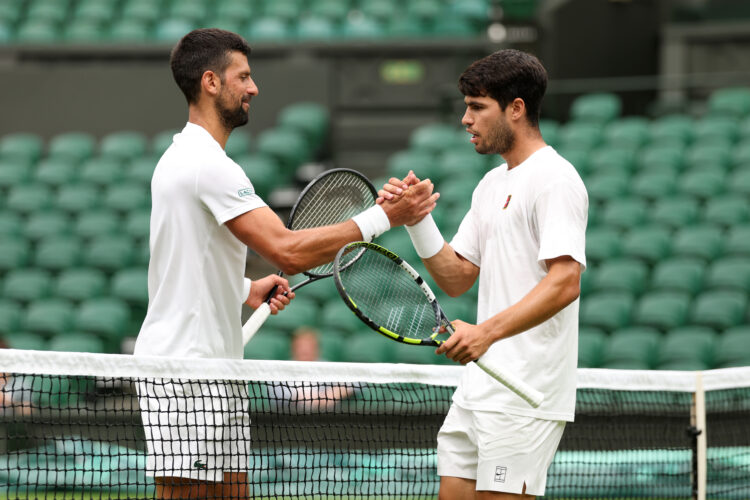 Novak Djokovic and Carlos Alcaraz embrace during practice prior to The Championships Wimbledon 2025